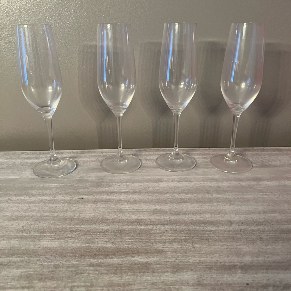 Set of four riedel champagne flutes.